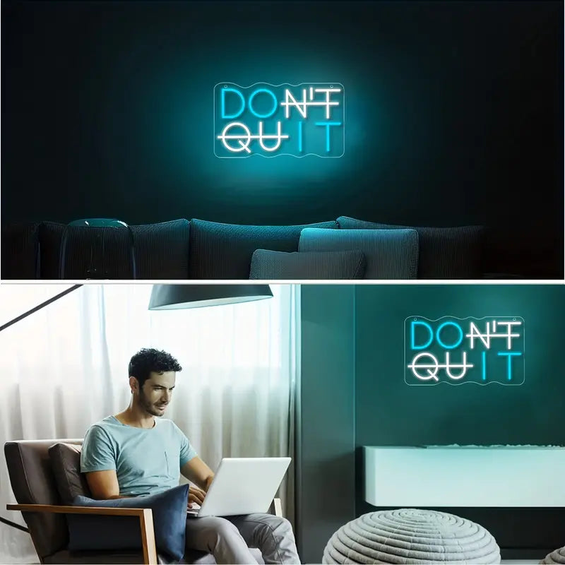 Modern LED neon sign, Don't Quit sign, man using laptop