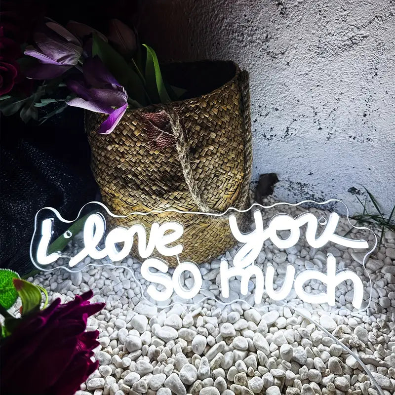 Neon "I love you so much" sign with pebble base
