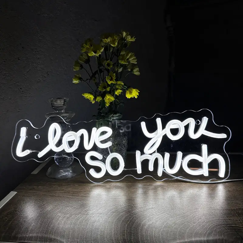I love you so much neon sign on table