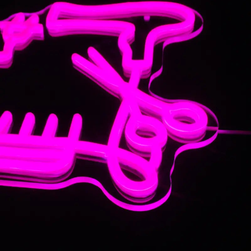 Pink neon barber shop sign