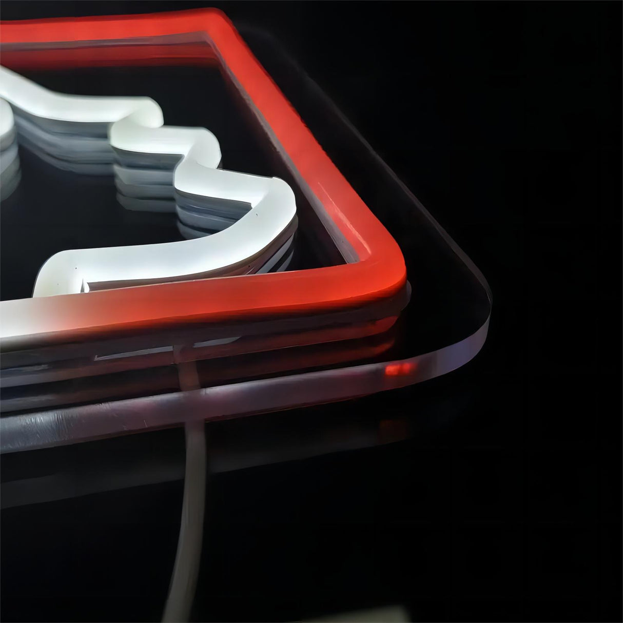 Baseball Man neon sign detail with red and white lights