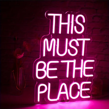 Pink neon sign: This Must Be The Place, decorative wall art