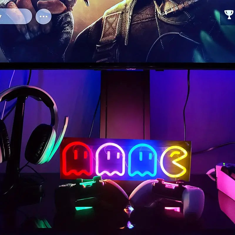Gaming room setup with Pac-Man LED neon sign