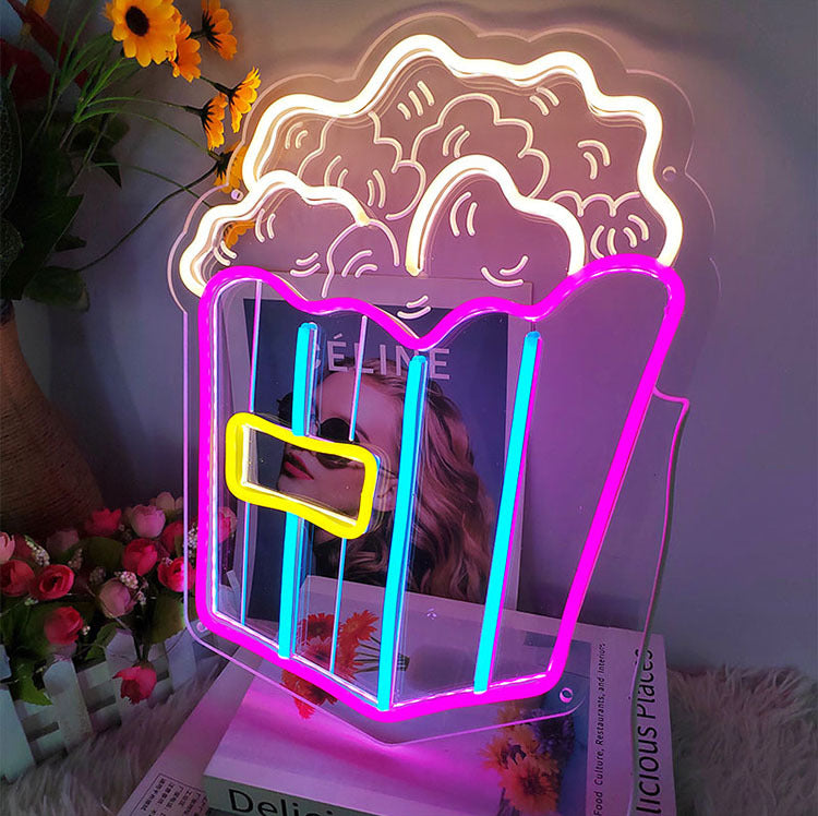 Neon popcorn sign with pink and yellow lights for home decor