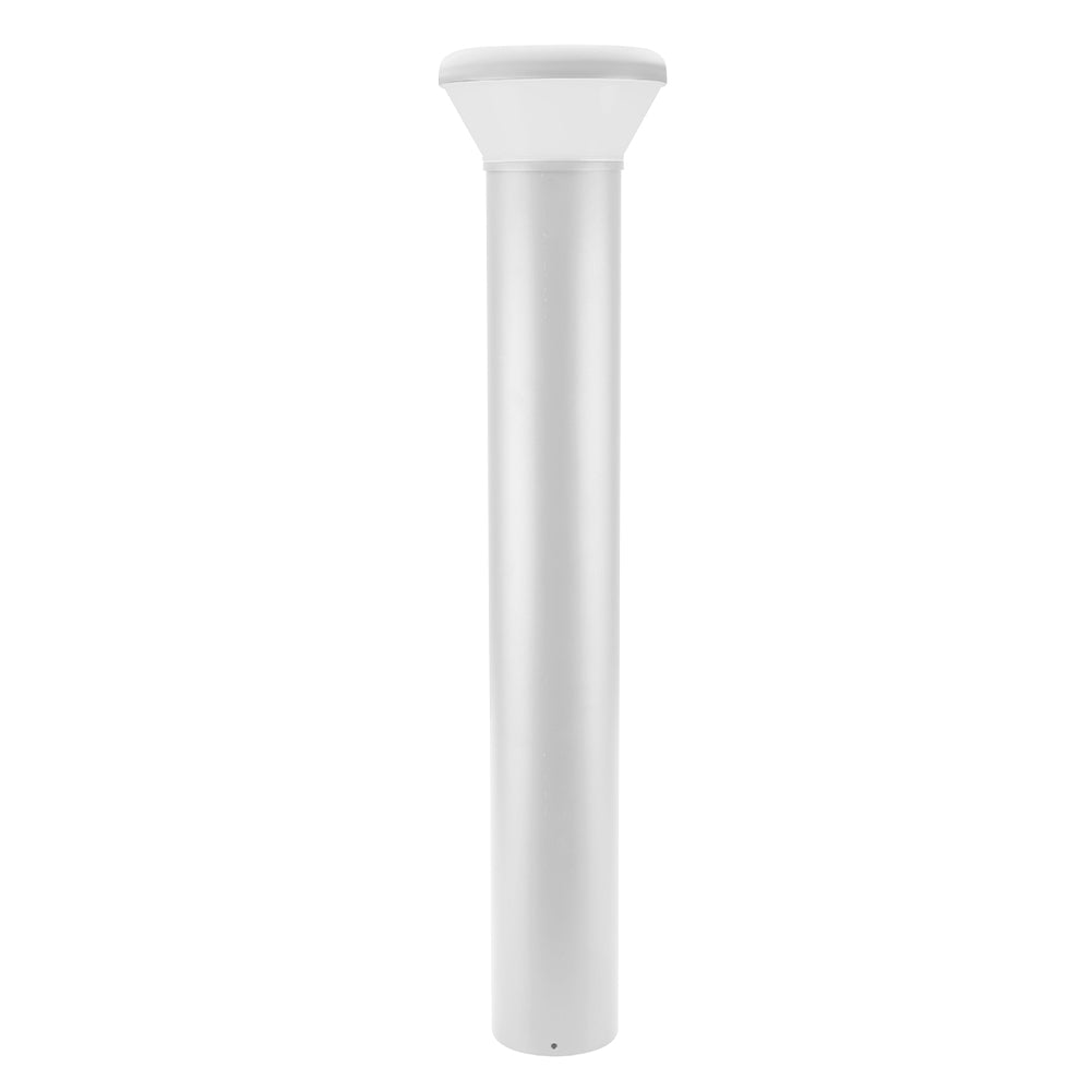 A modern white bollard light with a sleek, cylindrical design, illuminating a garden path at dusk.
