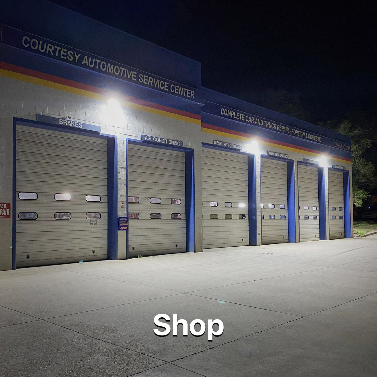 Automotive shop exterior illuminated by Hyperlite LED wall packs