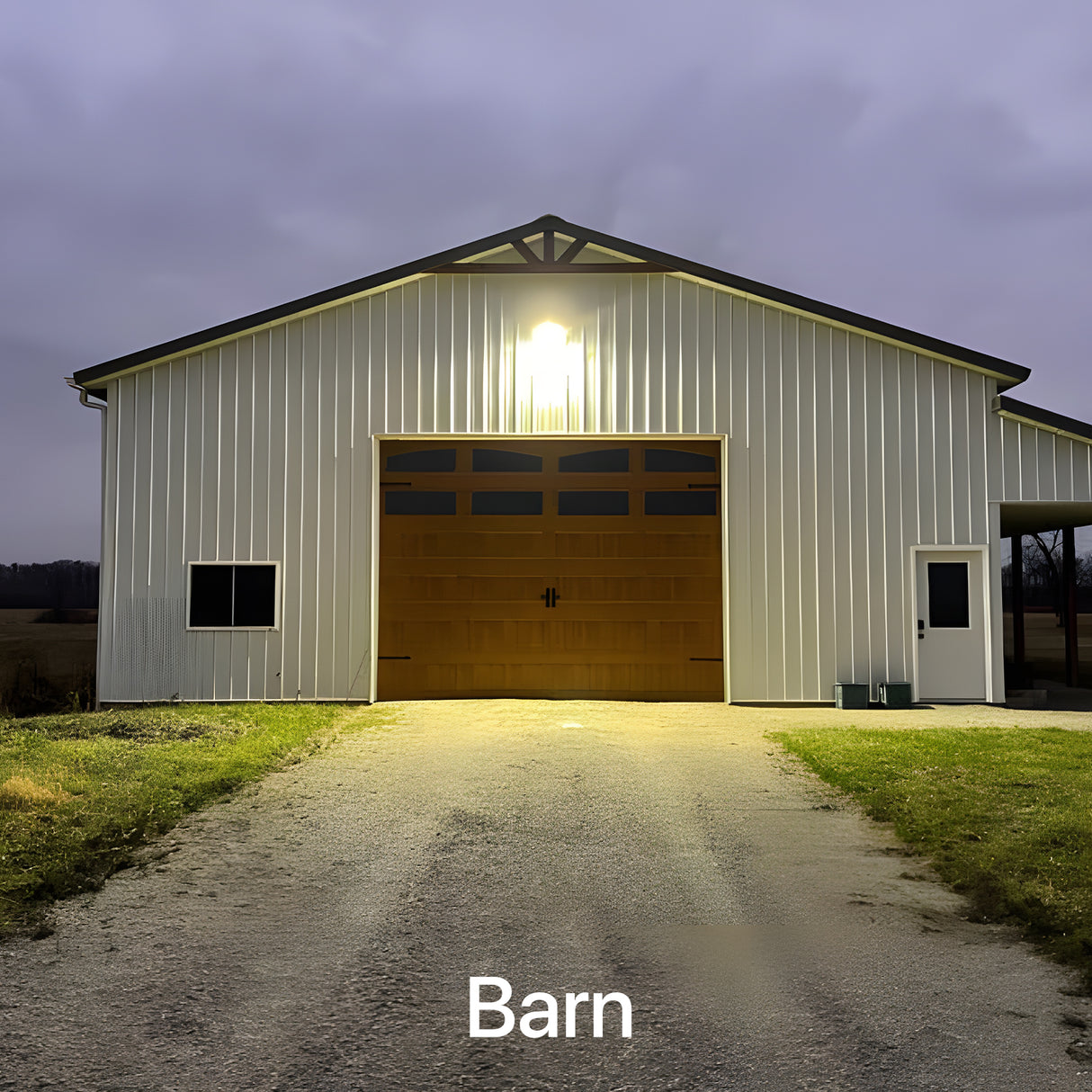 Wall pack light illuminating a barn at night