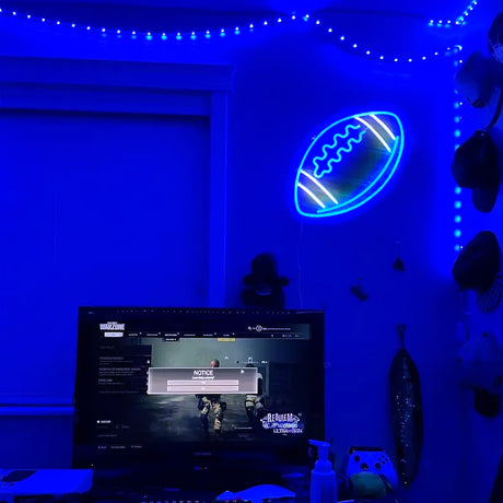 Blue neon football LED sign light in a game room