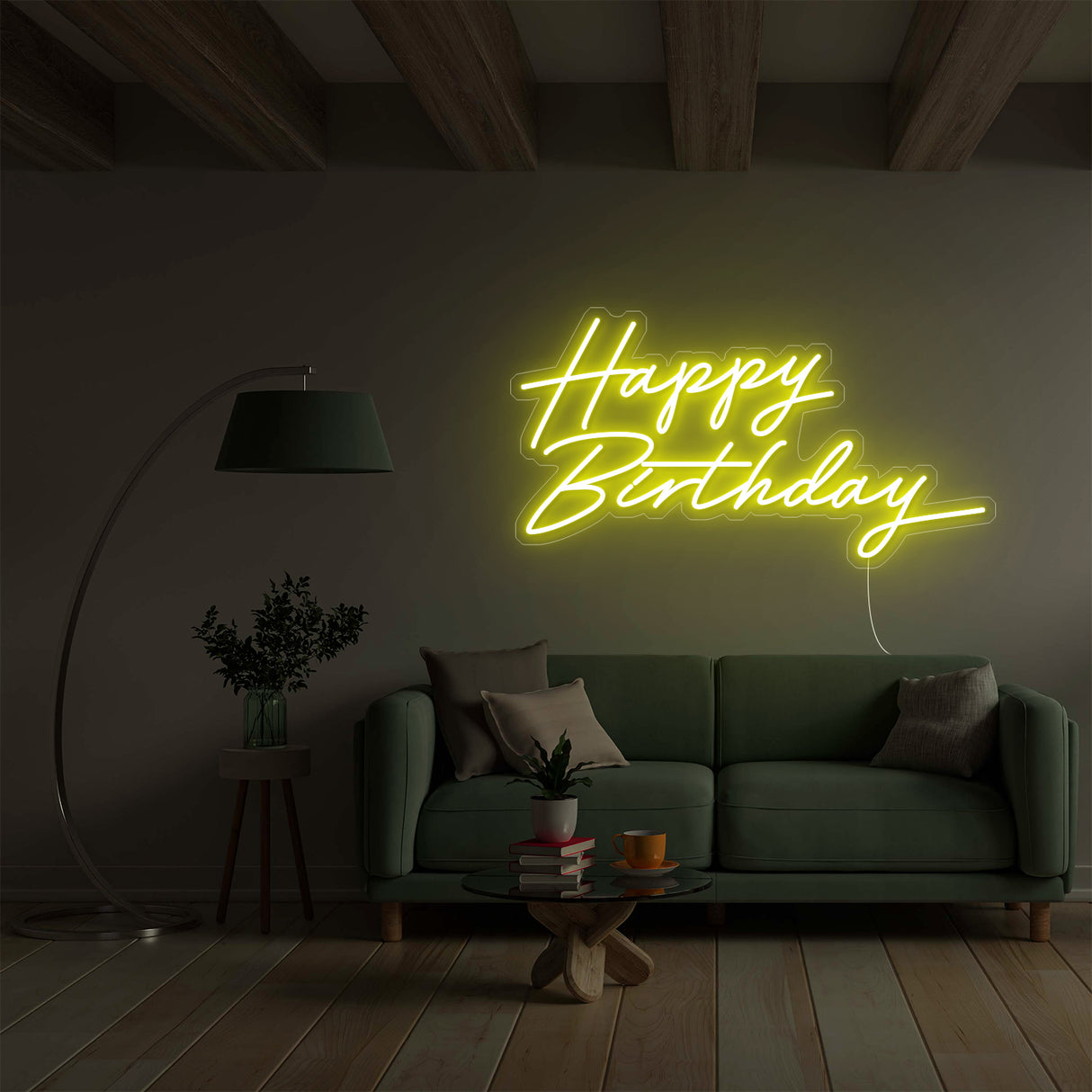 Yellow Happy Birthday neon sign over a green sofa