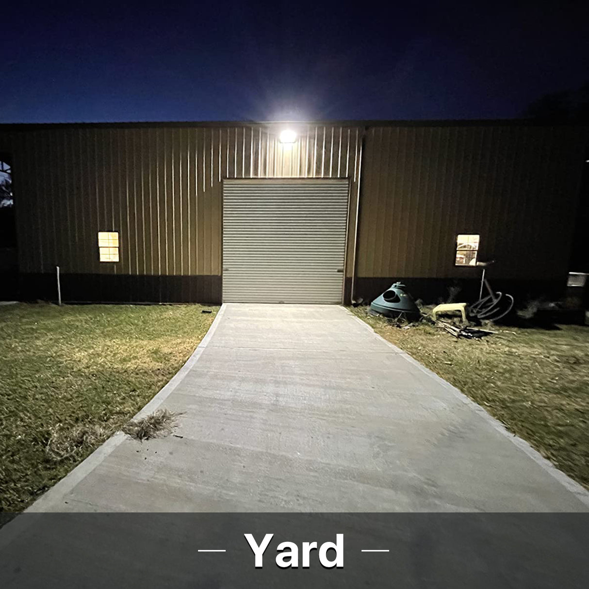 Hyperlite LED flood light illuminating a yard at night