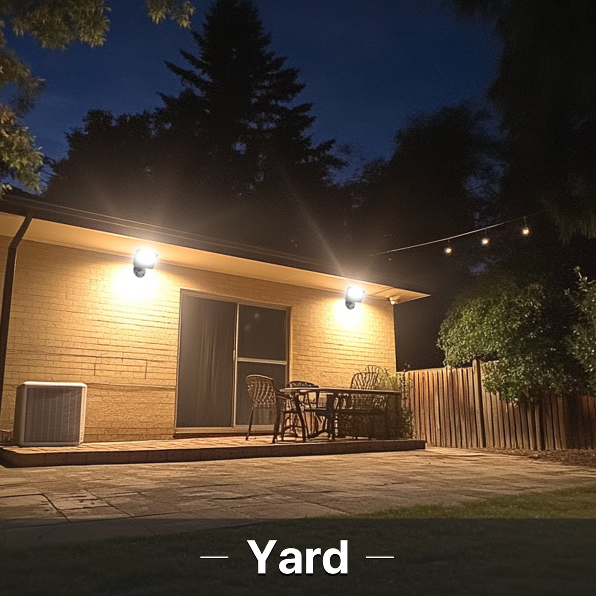 Hyperlite LED flood lights illuminating a backyard yard at night
