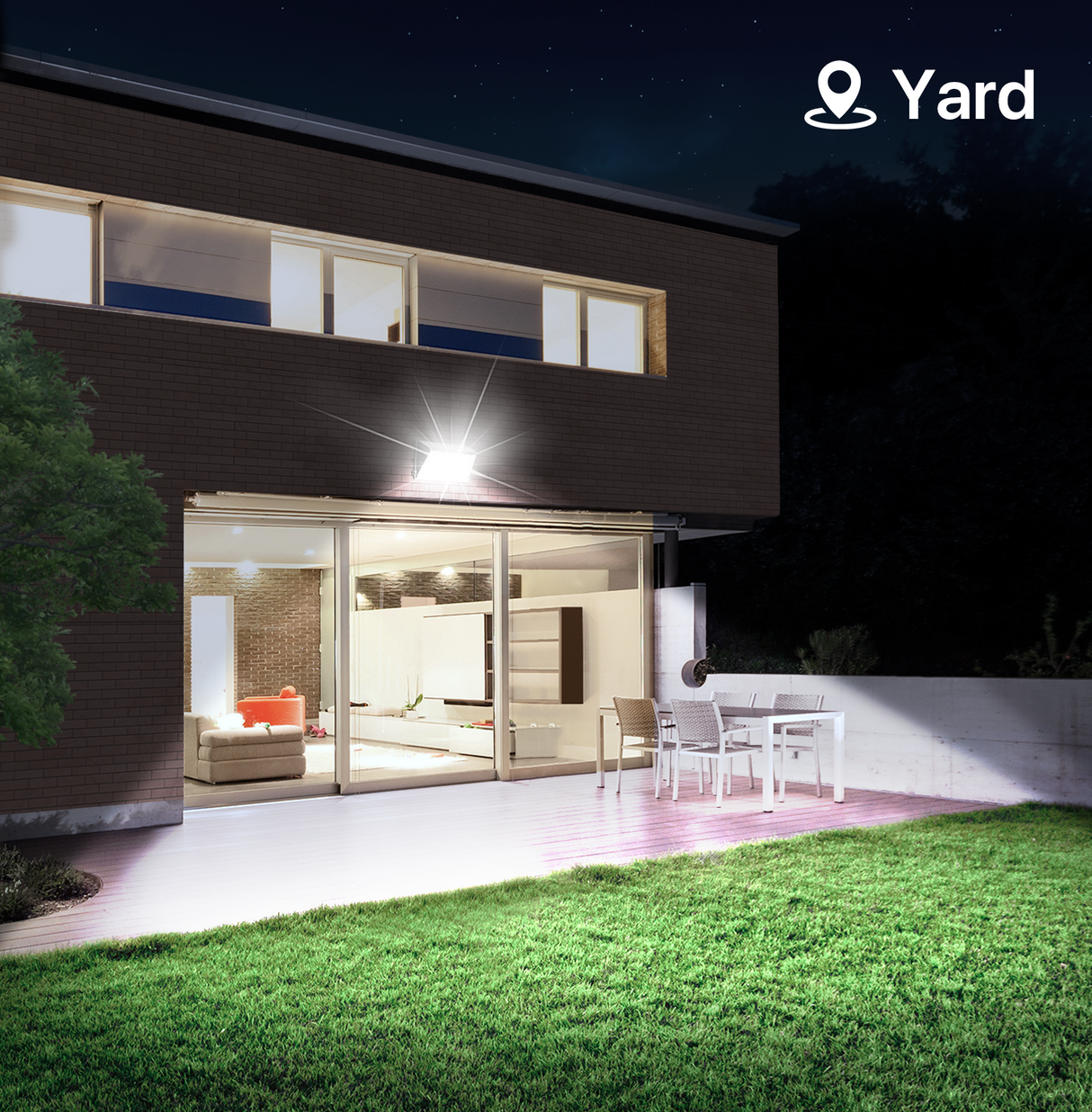 Outdoor wall pack light illuminating a yard at night