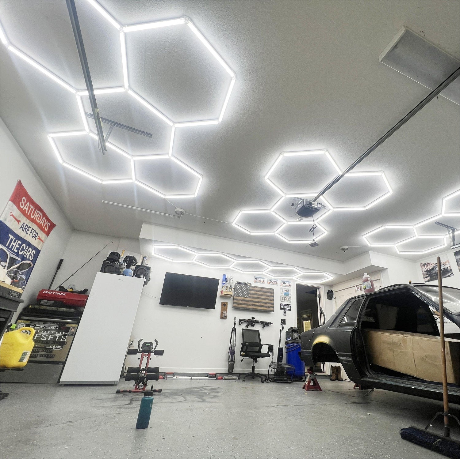 Garage with Hyperlite Hexagon Lights installed, bright LED lighting