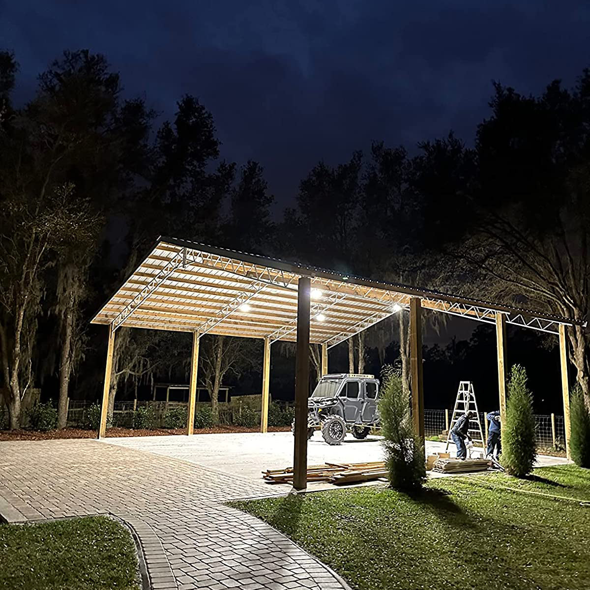 Carport lit with Hyperlite LED high bay lights at night