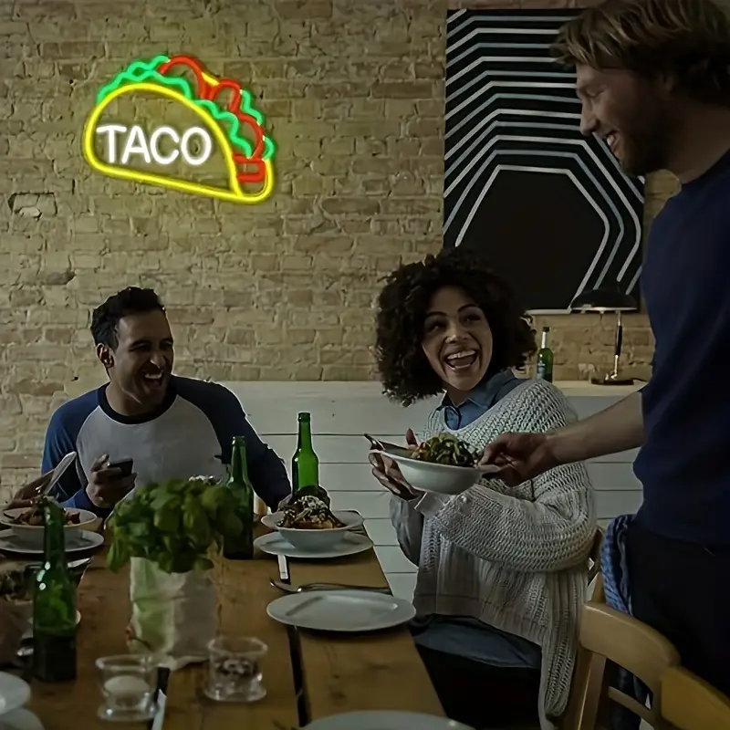 Customers enjoying food under the Taco Neon Sign Light