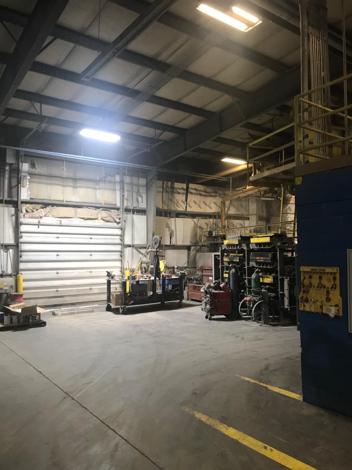 linear shop lights used in a warehouse with mechanic devices