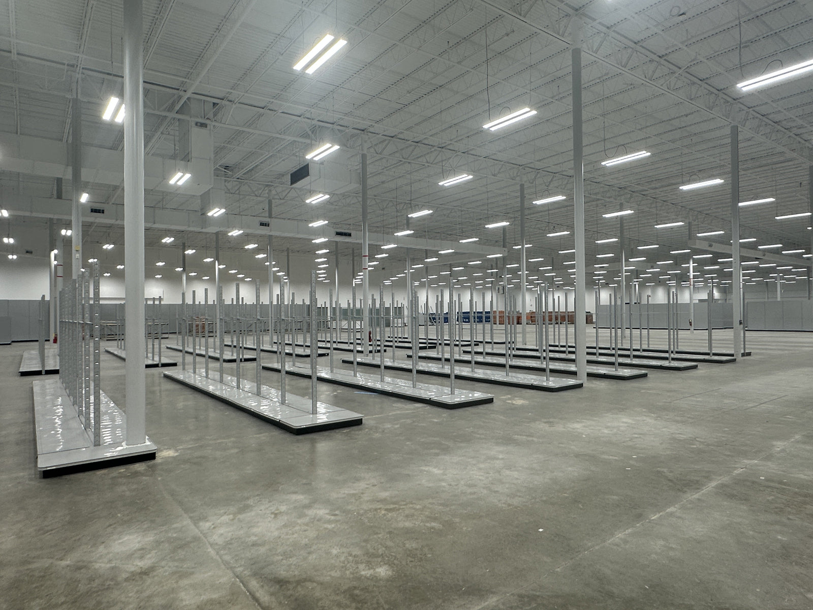 Designing Layouts for Facilities with Tall Obstructions