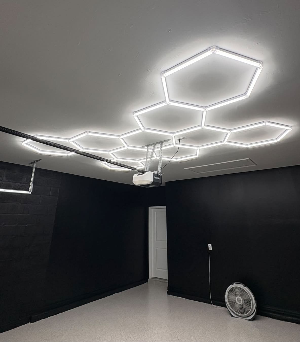 Illuminating Innovation: Gulf Haven Restoration Transforms Florida Garage with Hexagon Lights