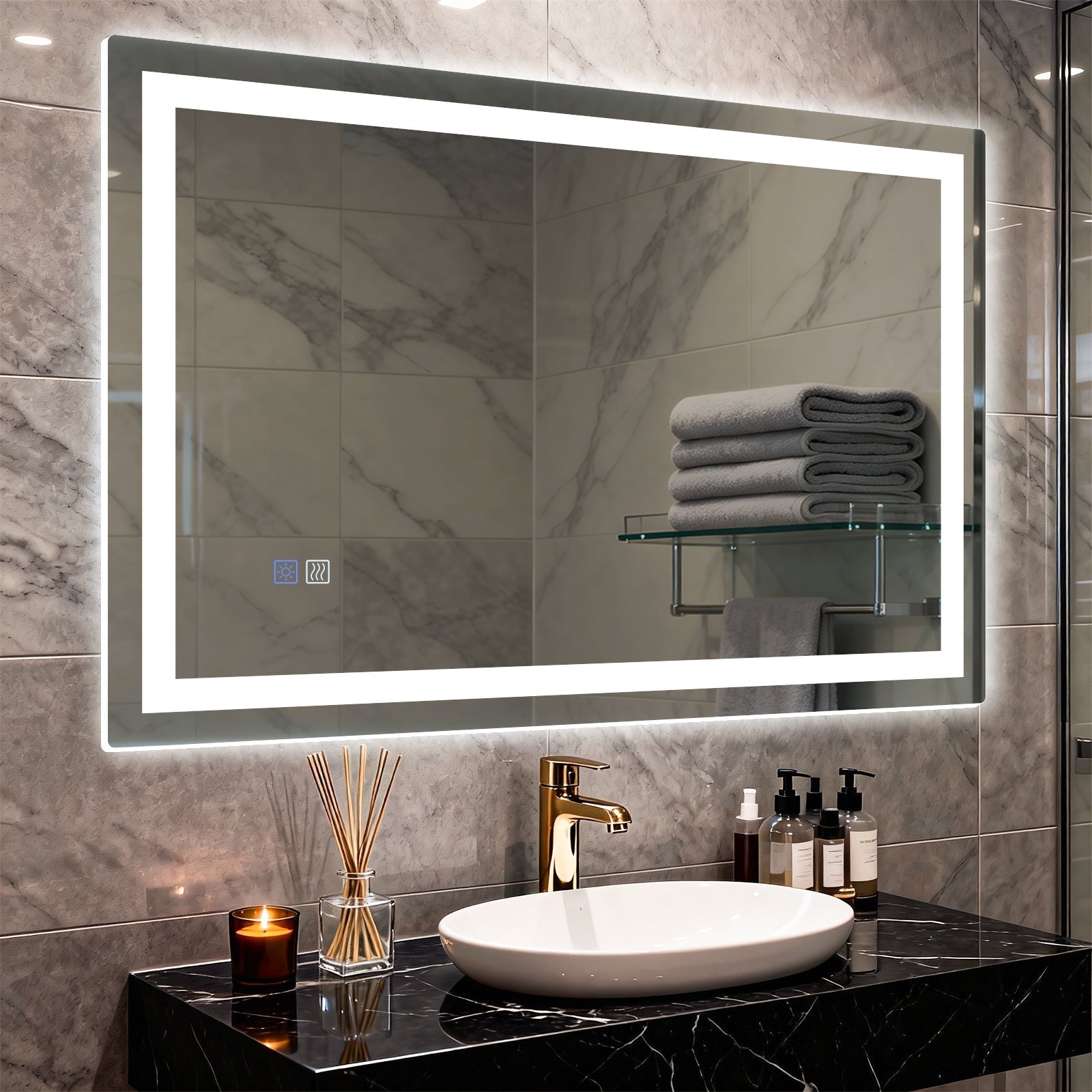 Modern bathroom with LED mirror, white vessel sink, black marble countertop, and neatly folded gray towels on a glass shelf.