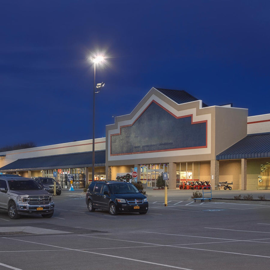 Well-lit commercial retail parking lot at night using LED fixtures