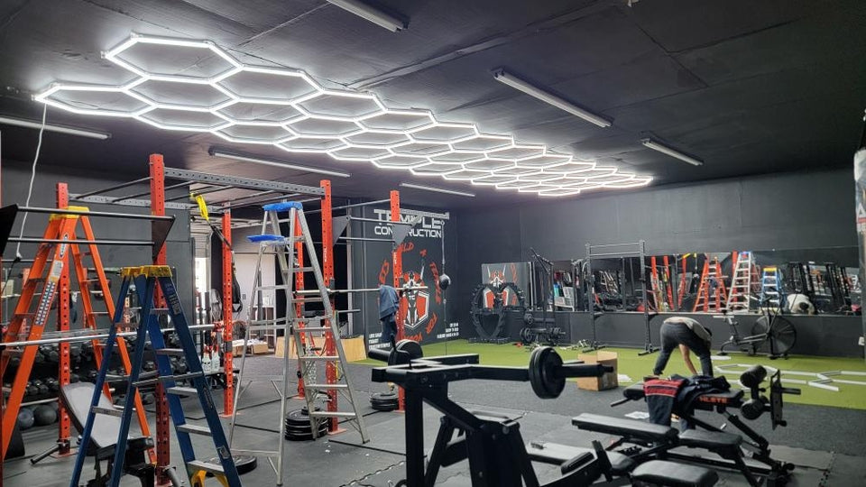 LED hexagon lights in a garage workshop — modular LED shop lights providing bright cool-white illumination