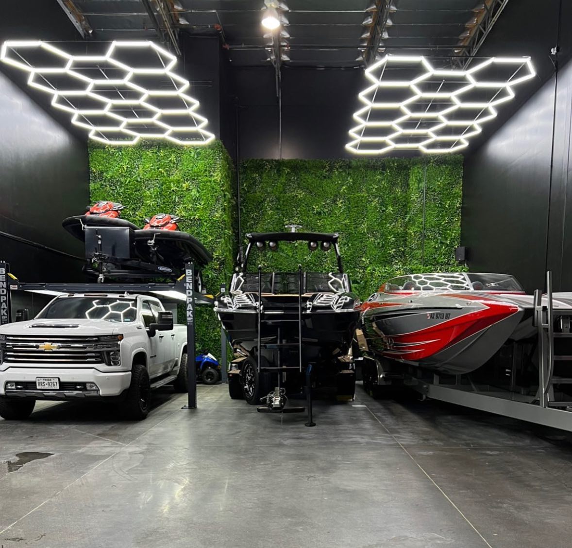 Hyperlite Hexagon Garage Lights illuminating a boat showroom