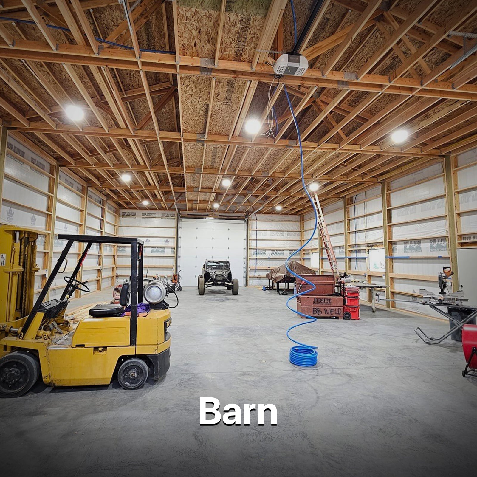 HYPERLITE LED high bay lights illuminating a barn