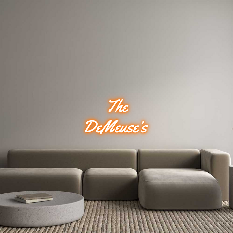 Custom orange neon sign of "The DeMeuse's" in Yellowtail font, wall-mounted above a modern sofa.