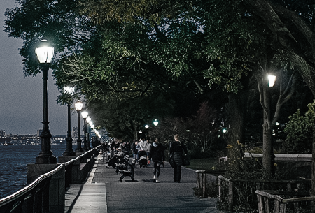 LED landscape lighting helps people walking in the outdoor environment.