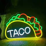 Taco neon sign glowing in vibrant colors.