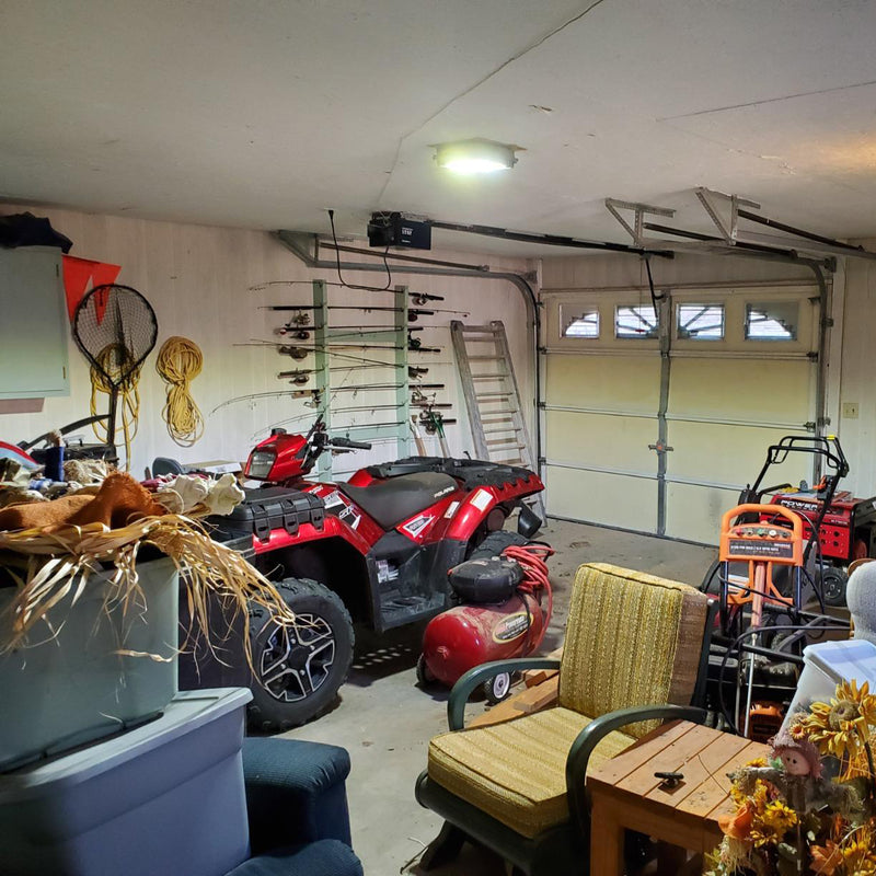 LED Canopy Light illuminating an ATV in a garage