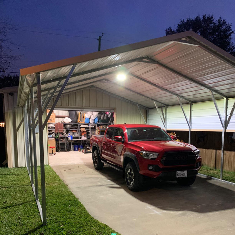 LED canopy light illuminating a car in a garage